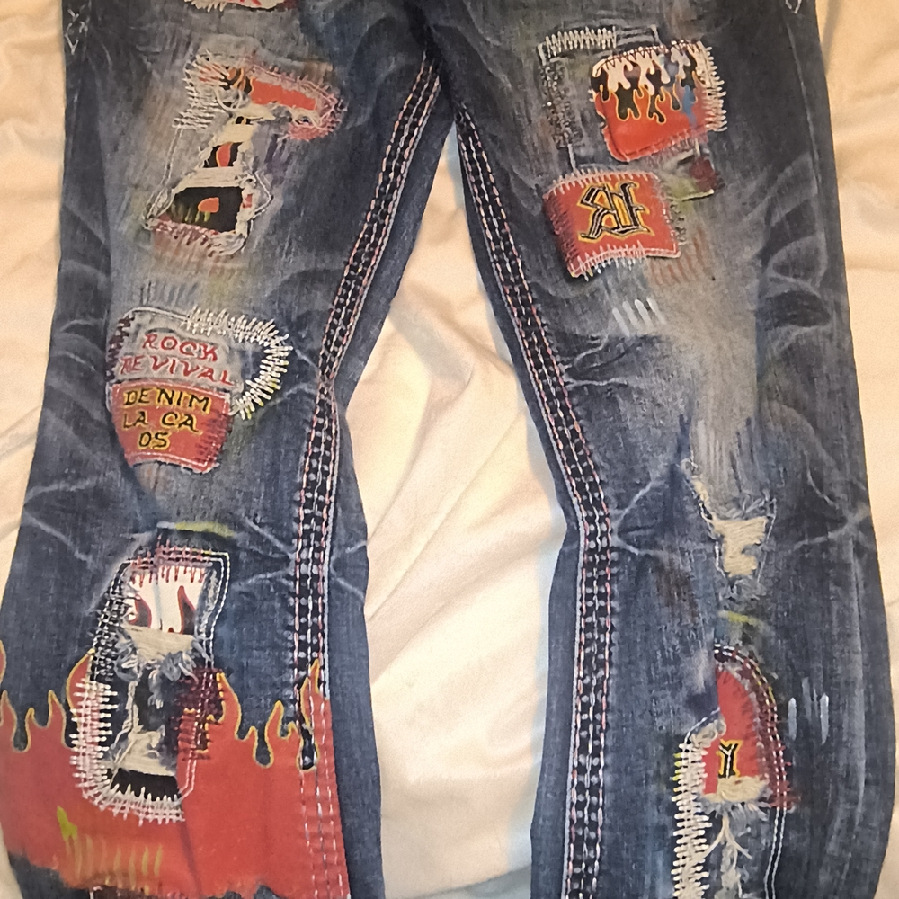 Rock Revival Blue Denim Jeans with Red Flame & Patch Accents